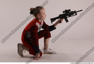 08 2018 01 DENISA KNEELING POSE WITH GUN